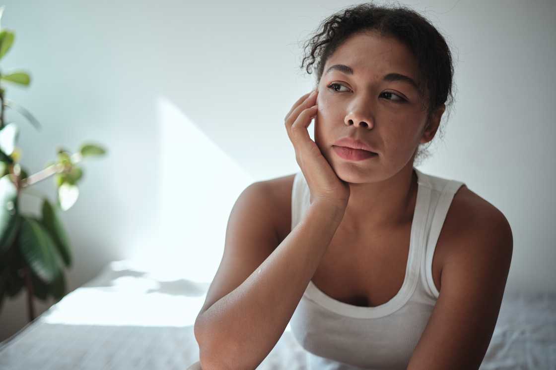 A sad lady thinks hard