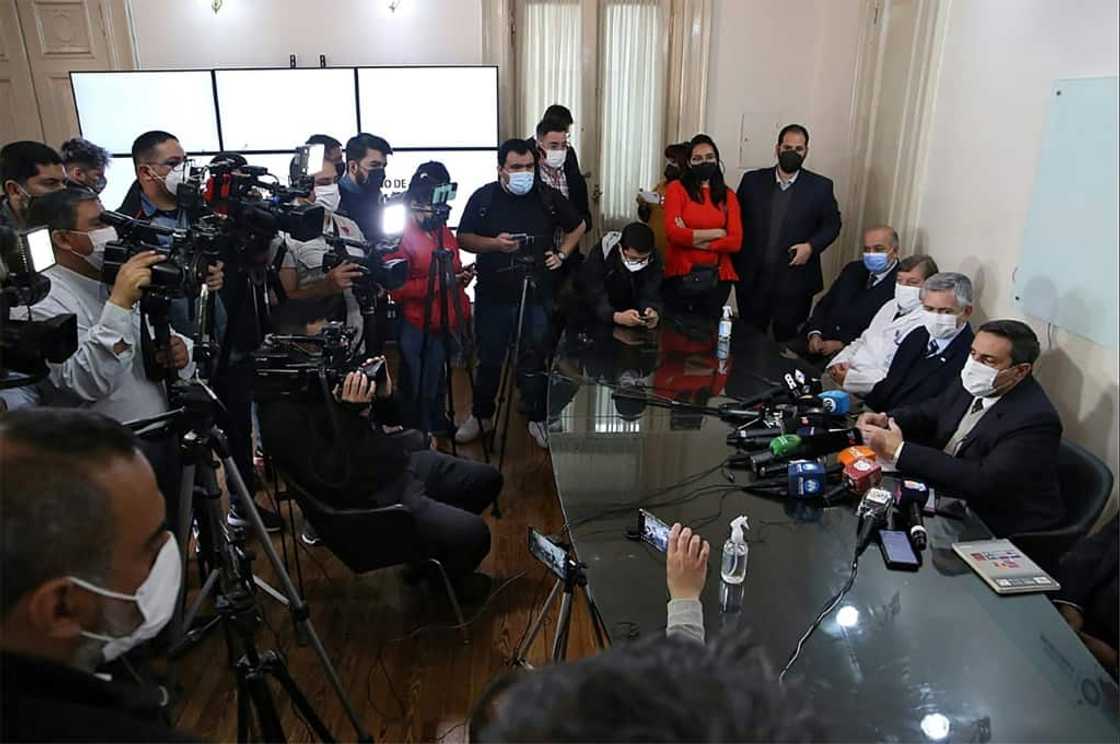 In this handout photo from the health ministry of Argentina's Tucuman province, provincial health minister Luis Medina Ruiz (R) announces the death of a third person with a pneumonia of unknown origin In this handout photo from the health ministry of Argentina's Tucuman province, provincial health minister Luis Medina Ruiz (R) announces the death of a third person with a pneumonia of unknown origin