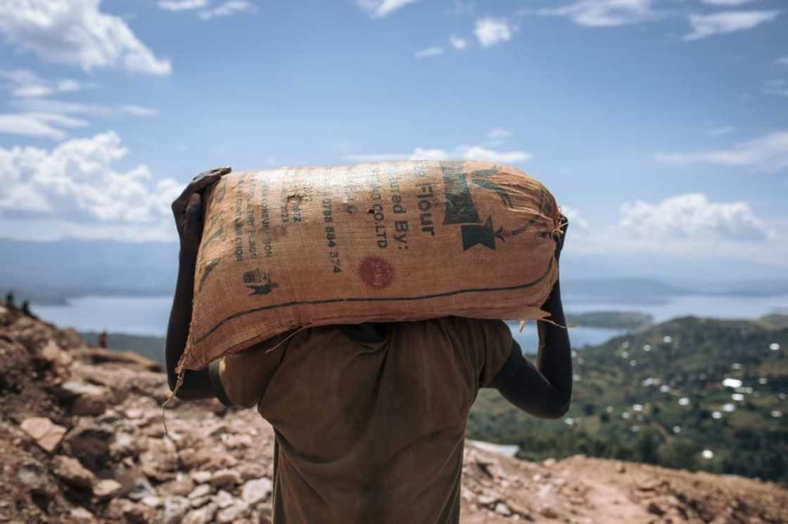 A miner in Luhihi hauls away spoil which will be carefully sifted for specks of gold A miner in Luhihi hauls away spoil which will be carefully sifted for specks of gold