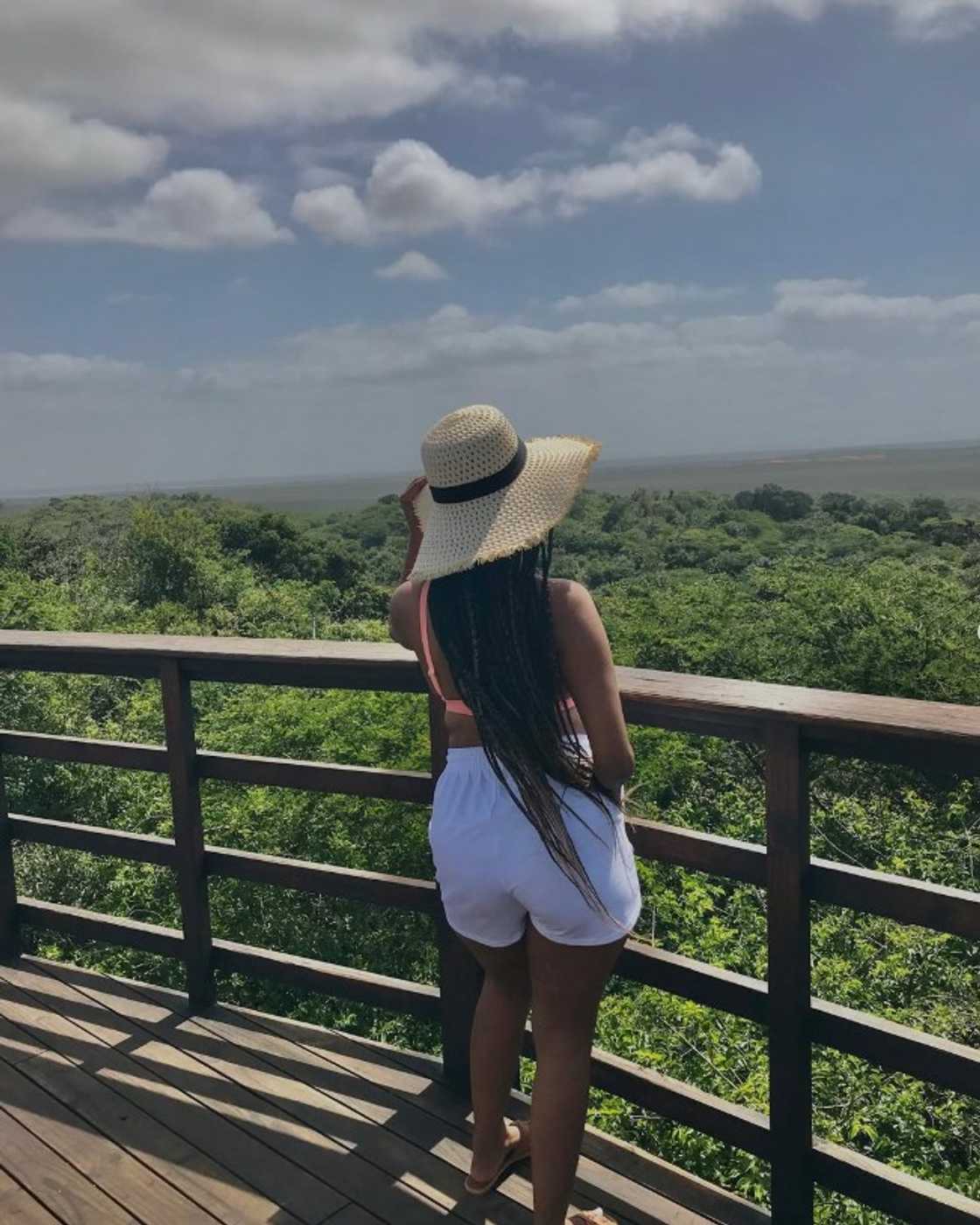 Young lady with KZN game drive plug enjoys nature