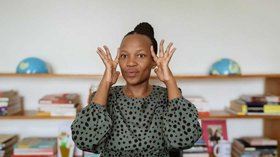 A woman known for showcasing payslips posed in a picture, looking stunned at a salary statement. A woman known for showcasing payslips posed in a picture, looking stunned at a salary statement.