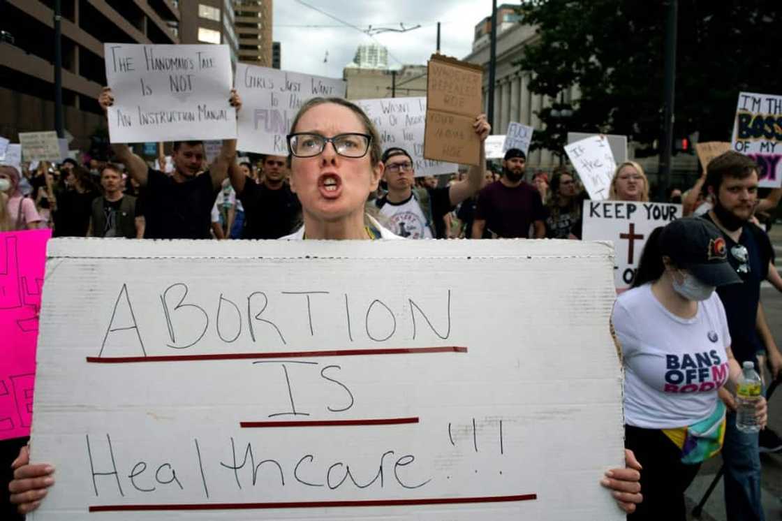 Kara Beasley, a doctor, protests the overturning of Roe v Wade in Denver -- doctors are also worried that patient care could suffer if physicians are worried about their legal situation Kara Beasley, a doctor, protests the overturning of Roe v Wade in Denver -- doctors are also worried that patient care could suffer if physicians are worried about their legal situation