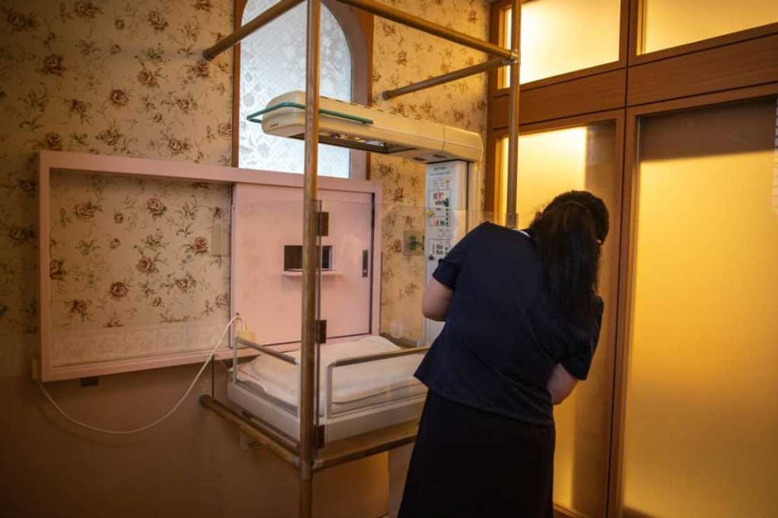 When the alarm sounds at Jikei hospital in southern Japan, nurses race down a spiral staircase to the baby hatch room