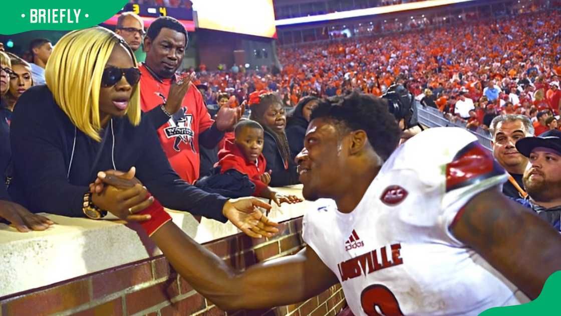 Lamar Jackson speaking with his mother