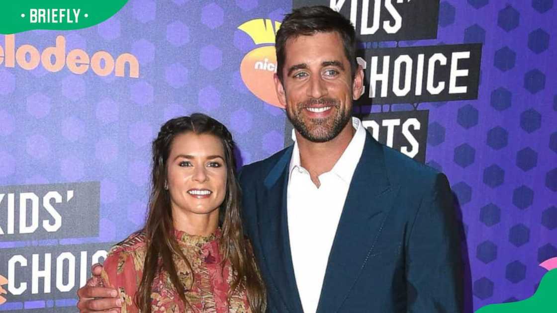 Danica Patrick and NFL player Aaron Rodgers at Barker Hangar Danica Patrick and NFL player Aaron Rodgers at Barker Hangar