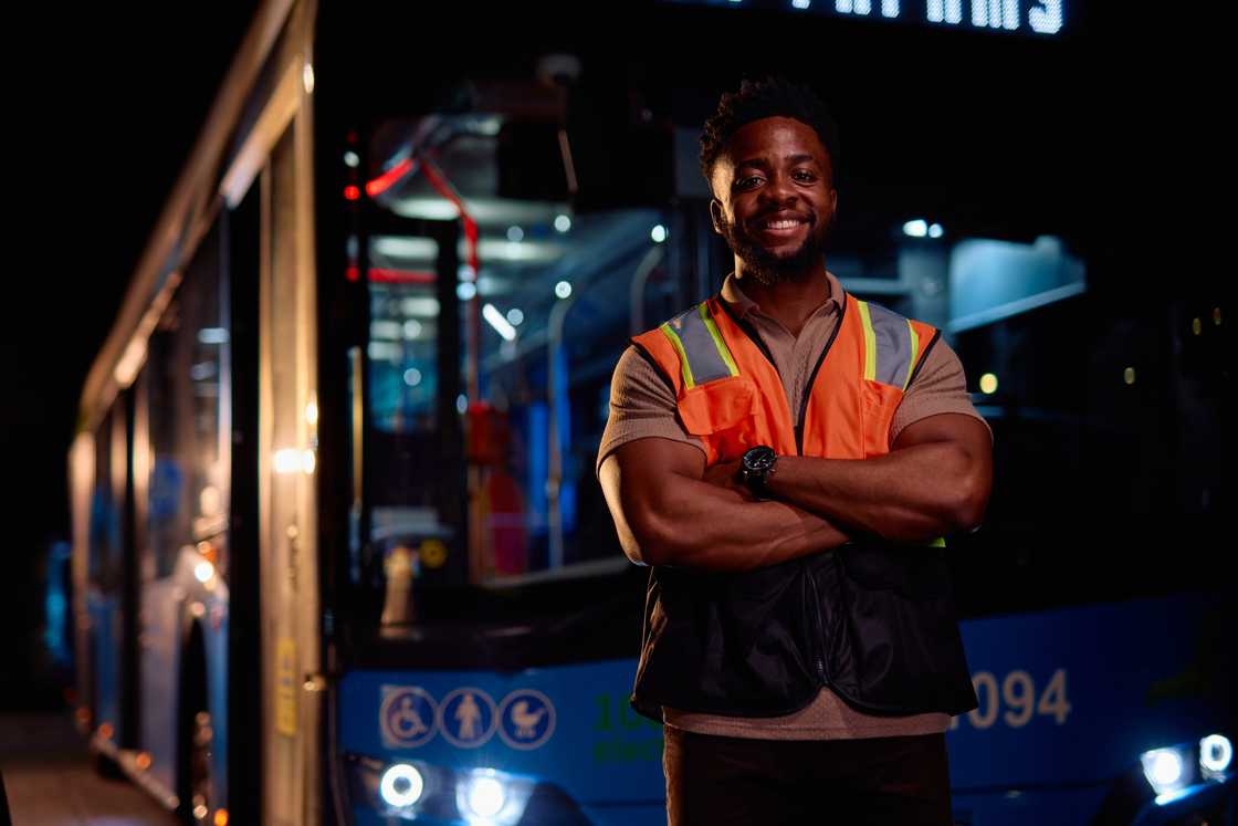 A man in a reflective vest at night during patrol