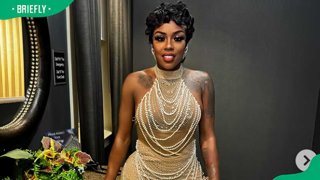 Badd Dolly in a sheer, pearl-adorned dress. Badd Dolly in a sheer, pearl-adorned dress.