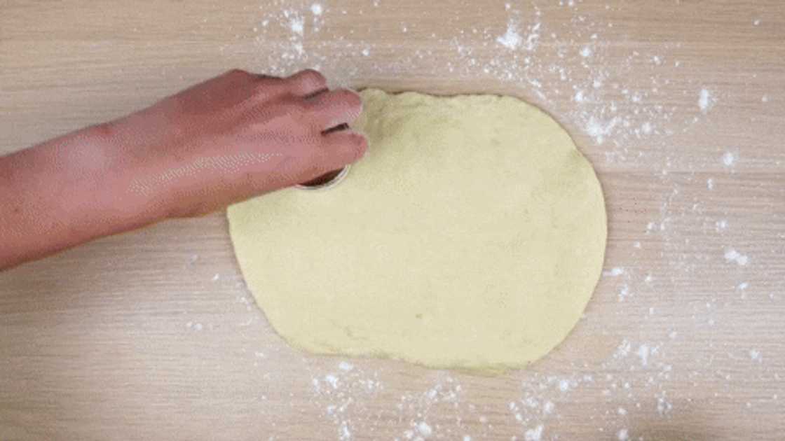 Cut out the dough with a round cookie cutter. Cut out the dough with a round cookie cutter.