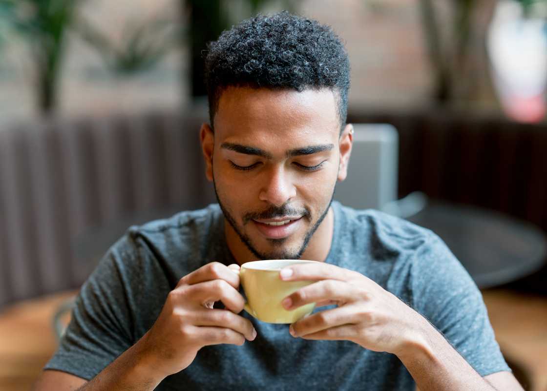 Man drinks coffee. Man drinks coffee.