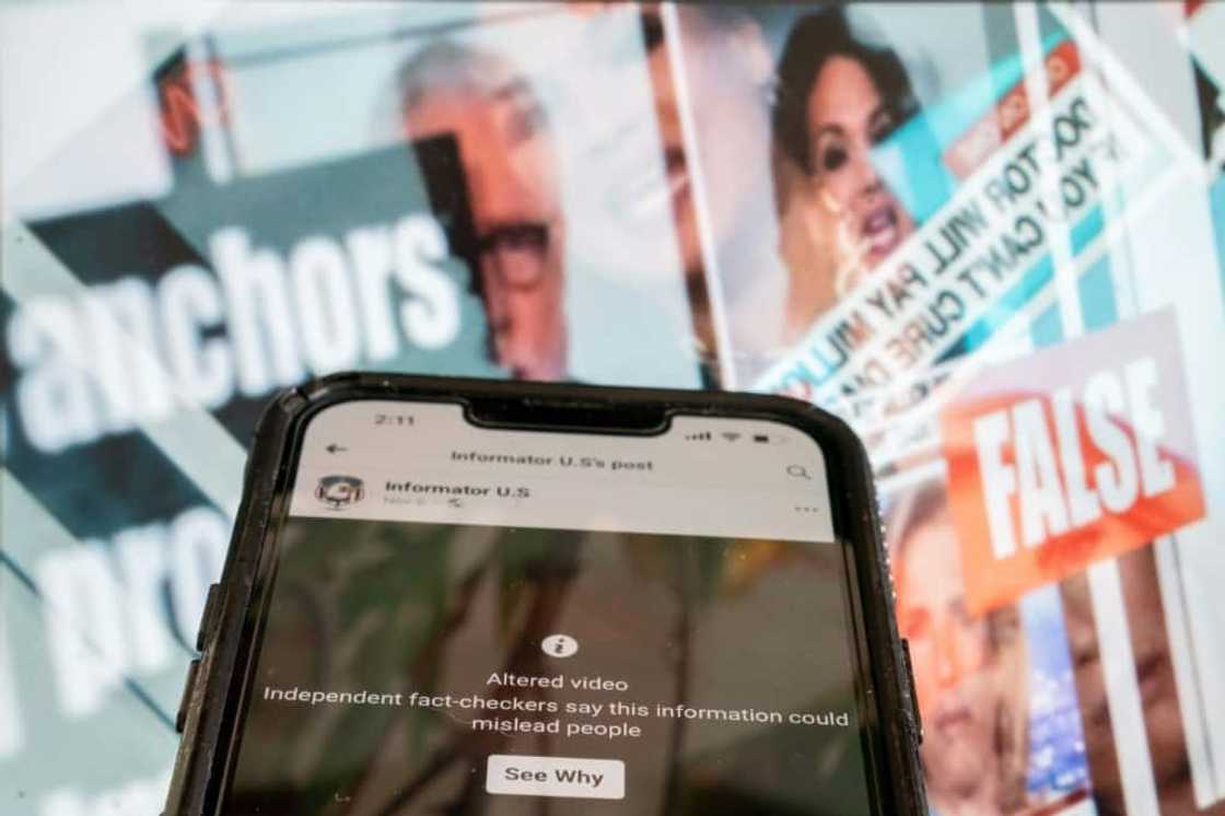 A phone screen showing a social media video marked as an "altered video," in front of a fact-checked image of news anchors where the claim about them was found to be false A phone screen showing a social media video marked as an "altered video," in front of a fact-checked image of news anchors where the claim about them was found to be false