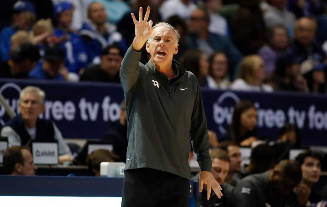 Jamie Dixon calls in a play during the first half of their game against the Brigham Young C