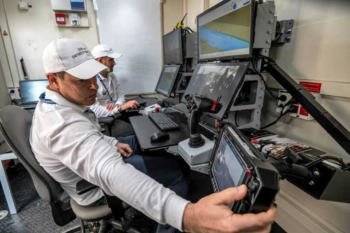 Controllers man a terminal at the command station of the Israel Aerospace Industries in an unmanned maritime demonstration during the Naval Defence and Maritime Security Exhibition (NAVDEX) at the Abu Dhabi International Exhibition Centre Controllers man a terminal at the command station of the Israel Aerospace Industries in an unmanned maritime demonstration during the Naval Defence and Maritime Security Exhibition (NAVDEX) at the Abu Dhabi International Exhibition Centre