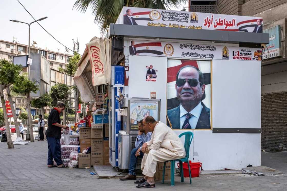 Portraits of Egypt's President Abdel Fattah al-Sisi adorn a stall in central Cairo for the government-sponsored "Citizen First" initiative, which aims to sell basic goods at reduced prices Portraits of Egypt's President Abdel Fattah al-Sisi adorn a stall in central Cairo for the government-sponsored "Citizen First" initiative, which aims to sell basic goods at reduced prices