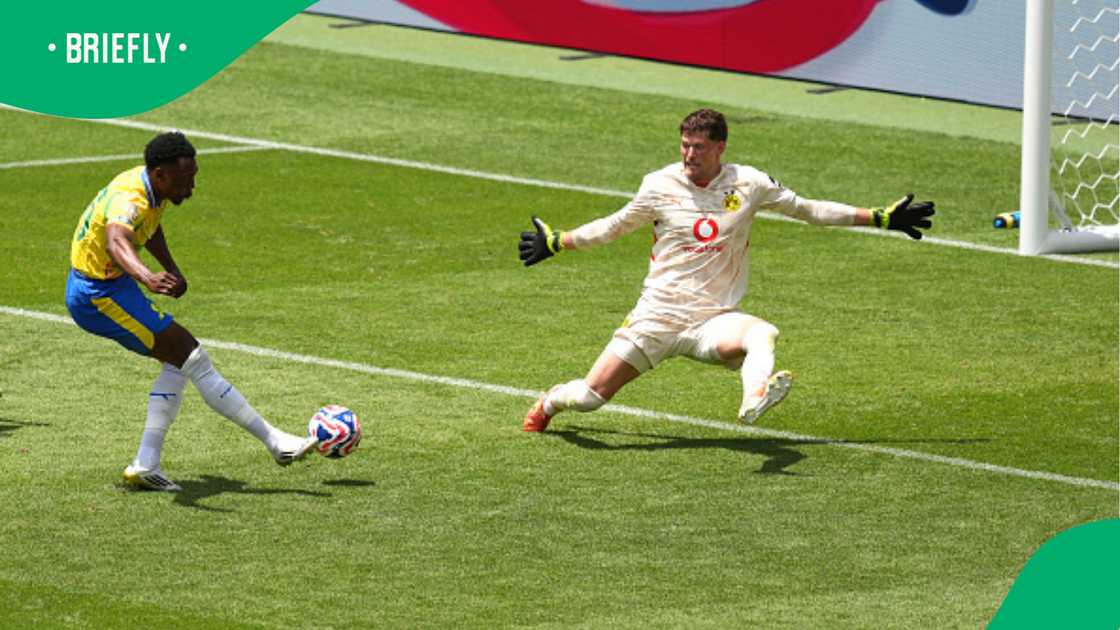 Lebo Mothiba hits the ball past Gregor Kobel to score Mamelodi Sundowns' third goal against Borussia Dortmund.