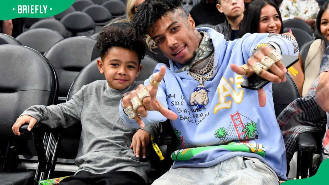 Rapper Blueface and his son Javaughn J. Porter at a 2023 basketball game between the Los Angeles Clippers and Portland Trail Blazers