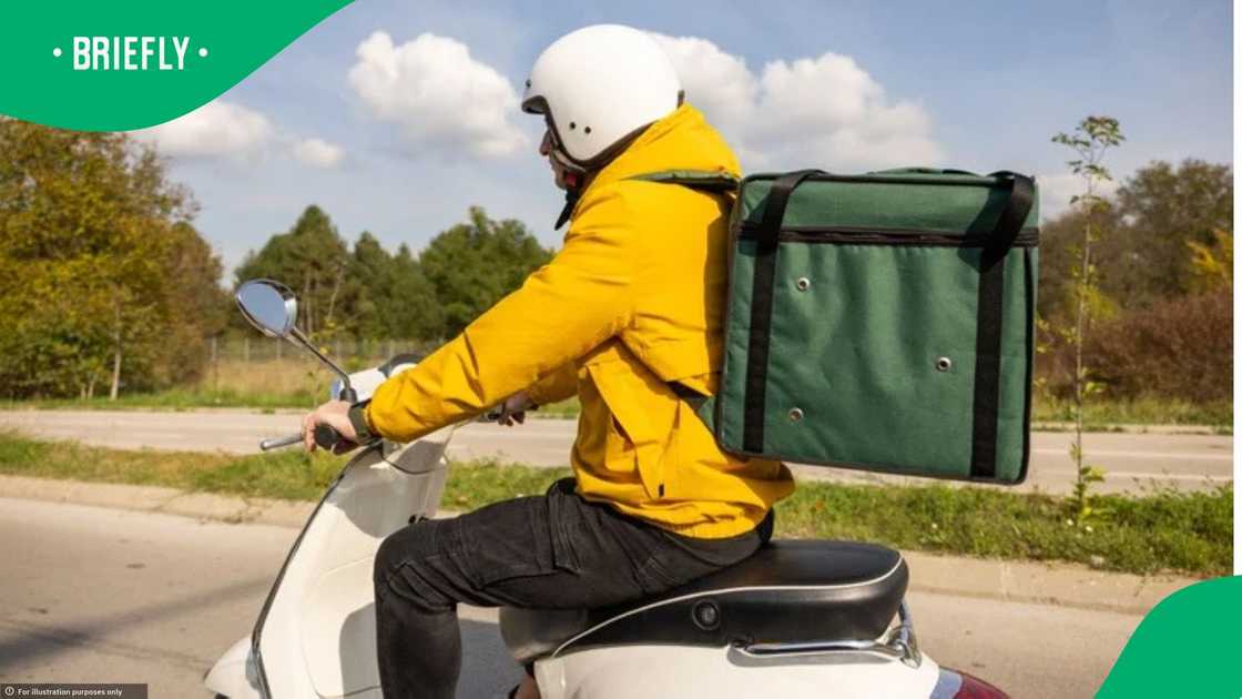 A delivery driver was spotted eating while on the job