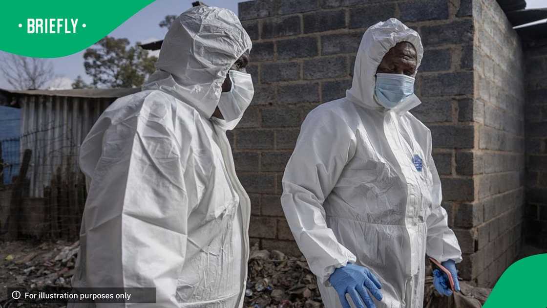 An investigation is conducted at the scene following the attack that at least 12 people were killed and nine others injured in a shooting at the informal settlement of Jumpers in the Cleveland area of Johannesburg, South Africa, on June 10, 2026