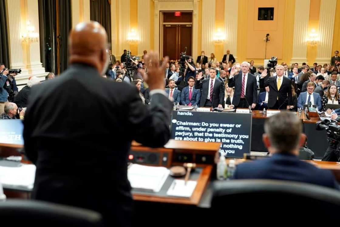 Former assistant attorney general for the Office of Legal Counsel Steven Engel (2nd L), former acting attorney general Jeffrey Rosen (C) and former acting deputy attorney general Richard Donoghue (R) are sworn in by committee chairman Bennie Thompson on June 23, 2022