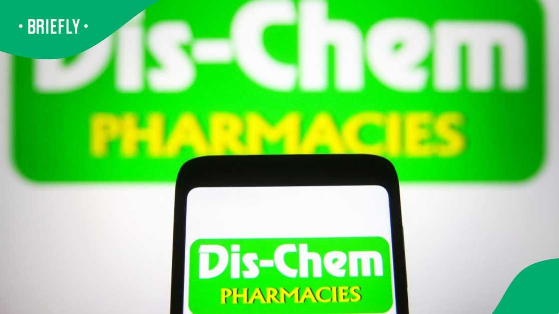 UKRAINE - 2021/11/05: In this photo illustration, Dis-Chem Pharmacies Ltd. logo is seen displayed on a smartphone and a pc screen UKRAINE - 2021/11/05: In this photo illustration, Dis-Chem Pharmacies Ltd. logo is seen displayed on a smartphone and a pc screen