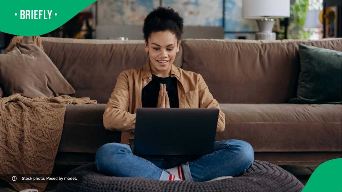 A happy woman using her laptop. A happy woman using her laptop.
