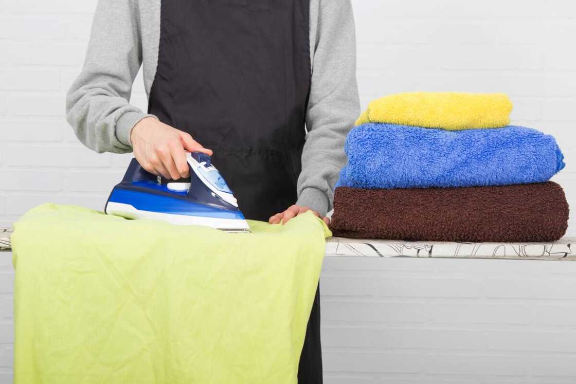 A closeup ironing clothes