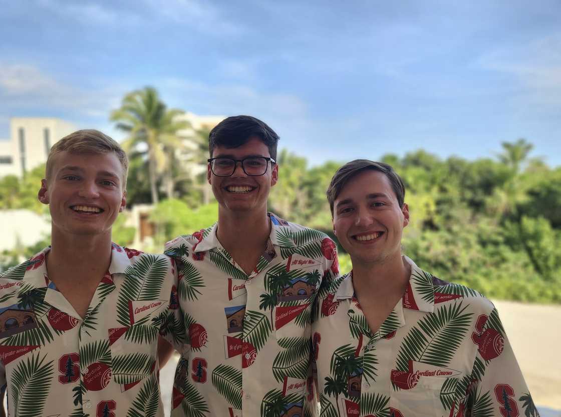 The Andrews brothers in matching shirts.