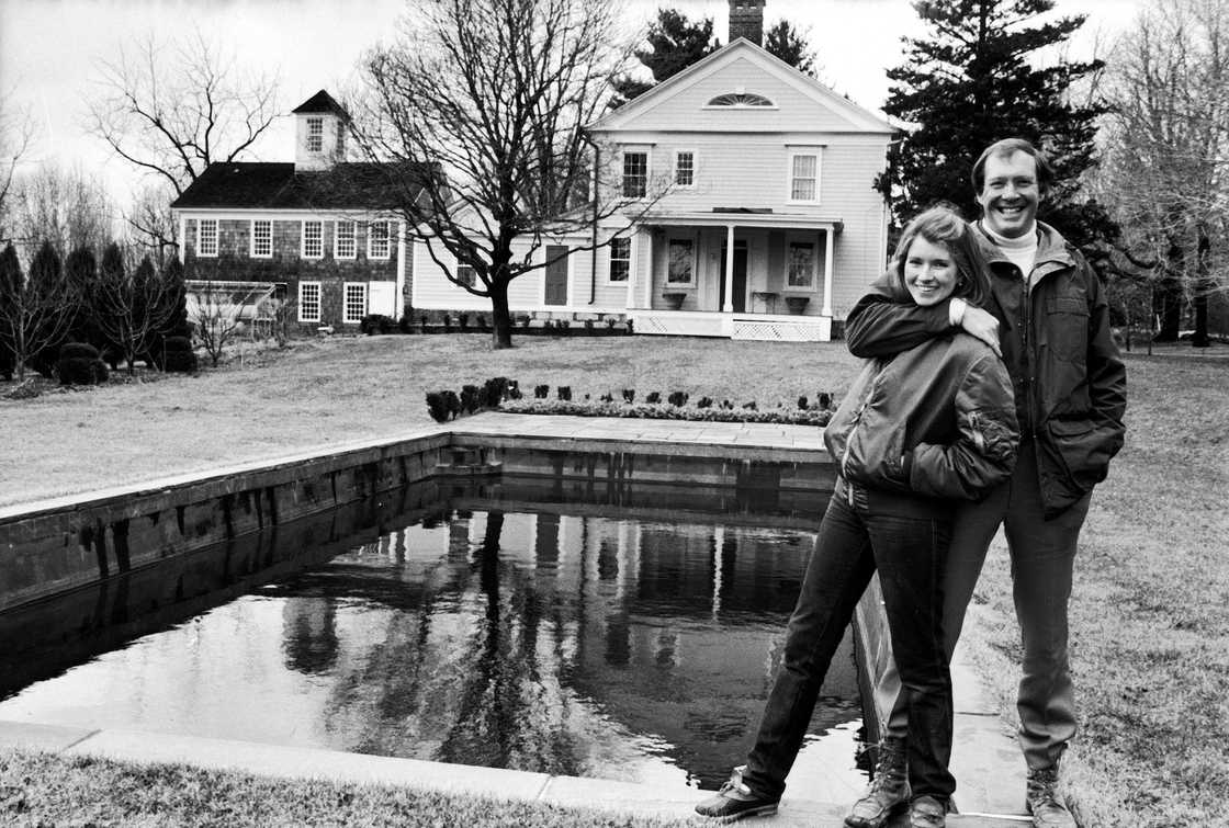 Martha Stewart (L) and Andrew Stewart (R) outside their home.