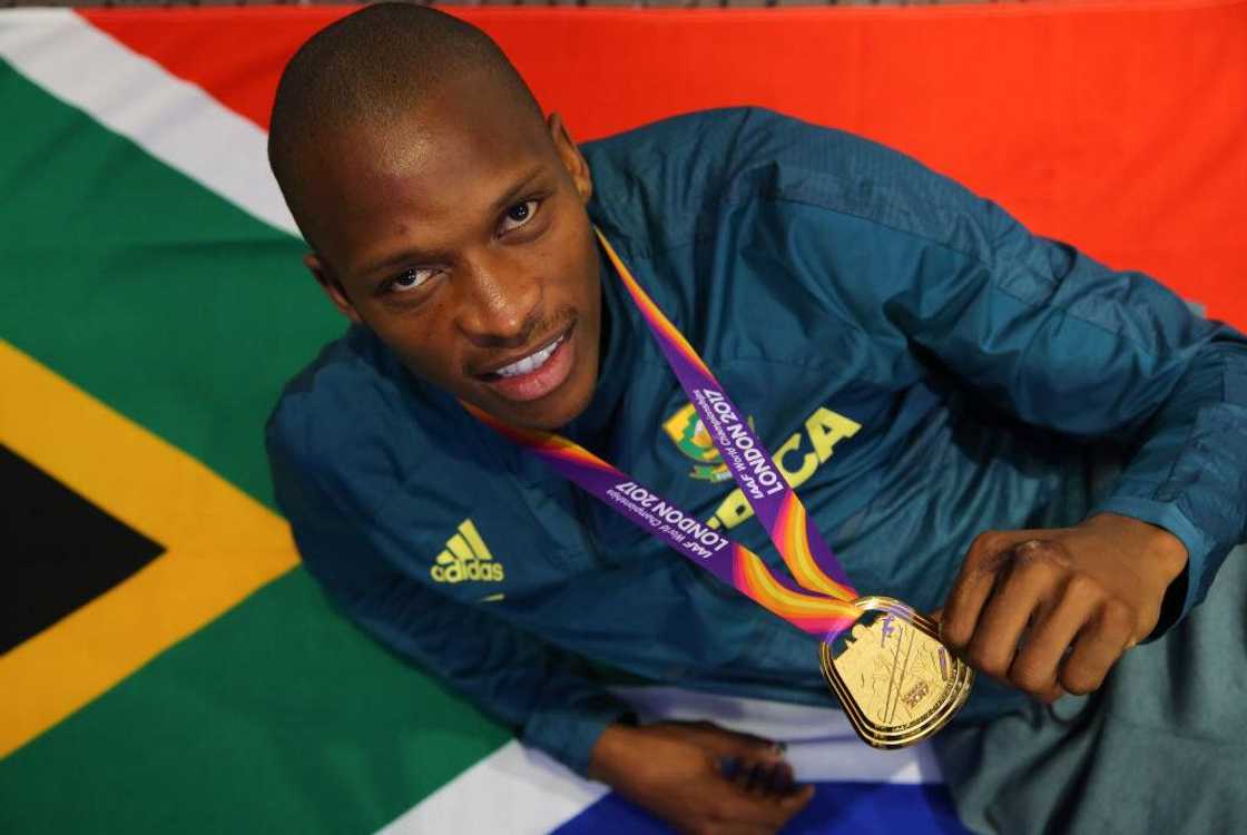 Luvo Manyonga poses with his gold medal at an Athletics South Africa press conference at the Grange Tower Hotel.