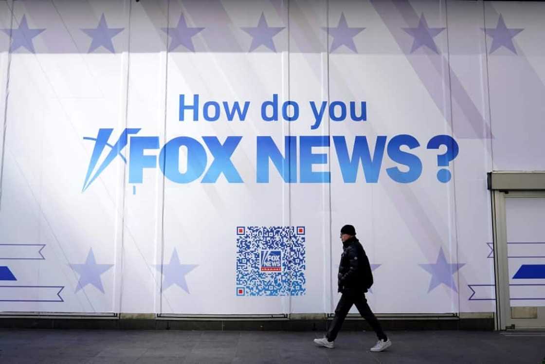 A person walks past the Fox News Headquarters at the News Corporation building in New York City