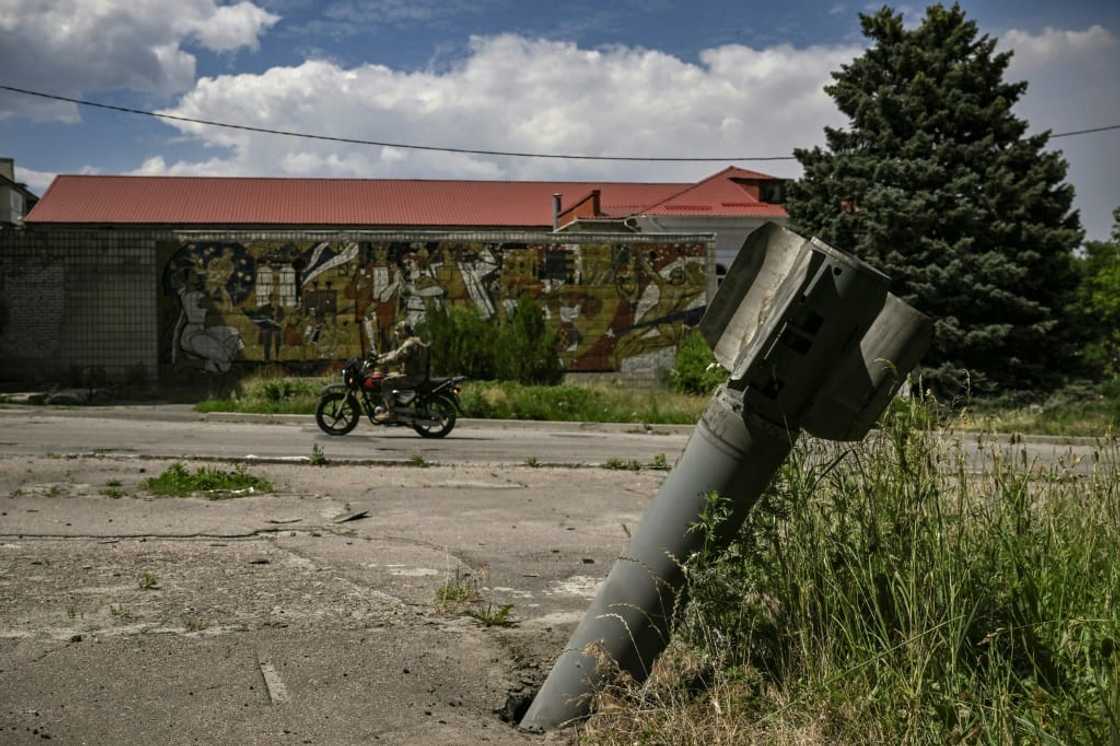 The tail of a rocket stuck in the pavement Lysychansk on Friday