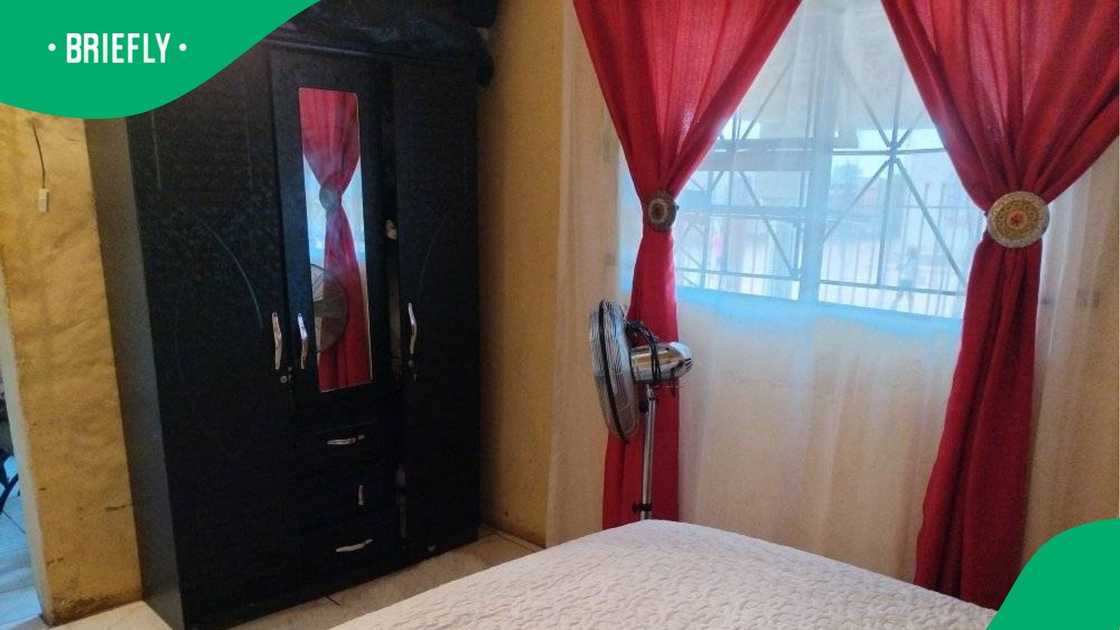 A woman showed another angle of her bedroom. A woman showed another angle of her bedroom.
