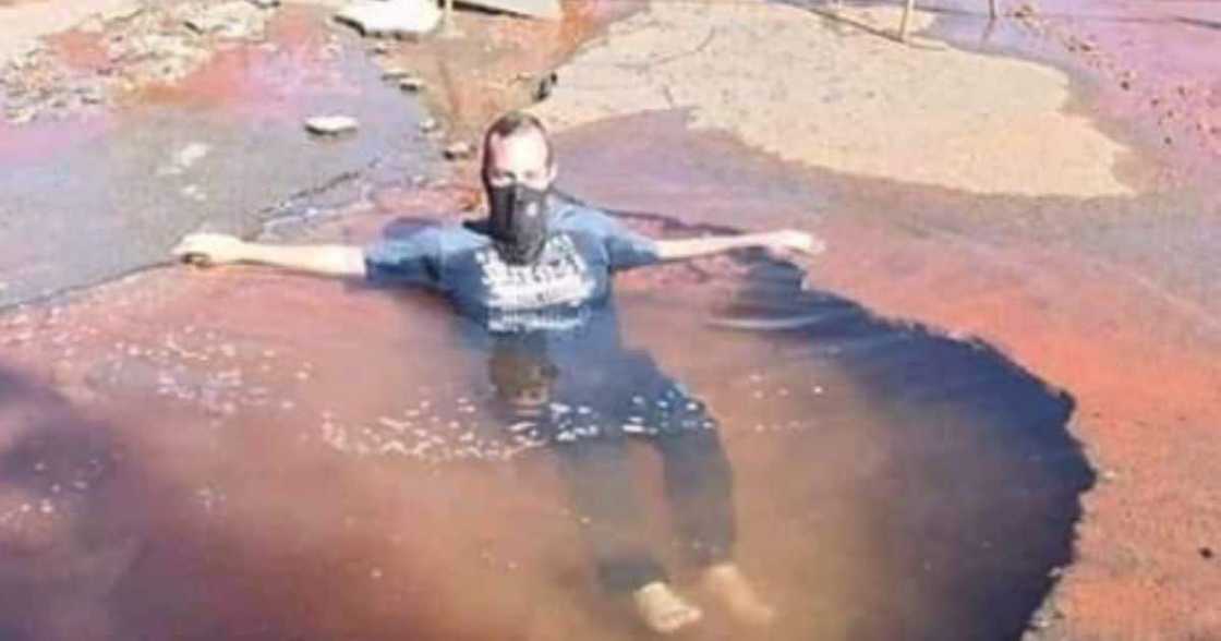 pothole, man, South, Africa, staying, swimming, water, jeans, suburbs pothole, man, South, Africa, staying, swimming, water, jeans, suburbs