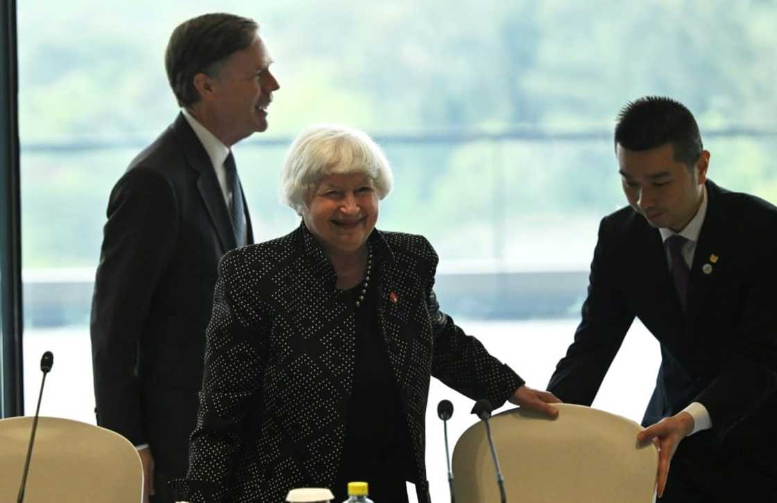 US Treasury chief Janet Yellen (C) and Ambassador to China Nicholas Burns (L) attend a roundtable with business leaders in Guangzhou