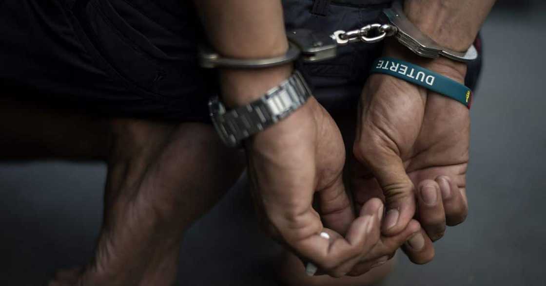 suspect in handcuffs suspect in handcuffs