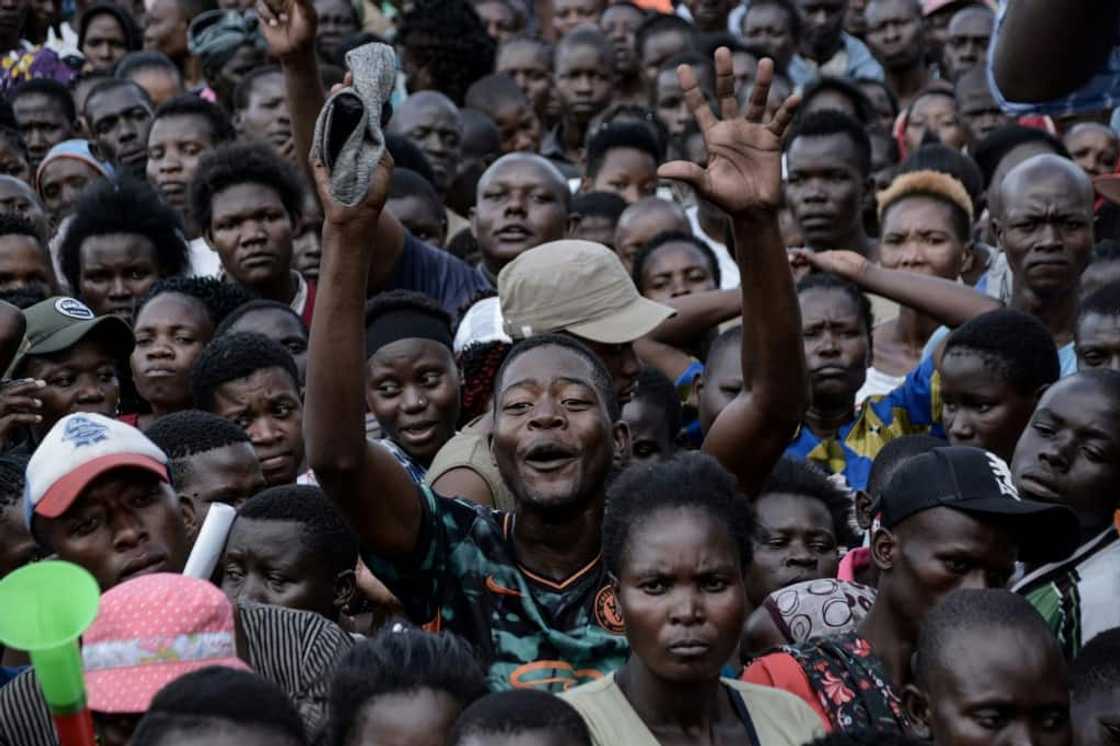Politicians in Kenya offer cash, umbrellas, shirts, caps and even packets of maize flour to anyone who attends their rallies Politicians in Kenya offer cash, umbrellas, shirts, caps and even packets of maize flour to anyone who attends their rallies
