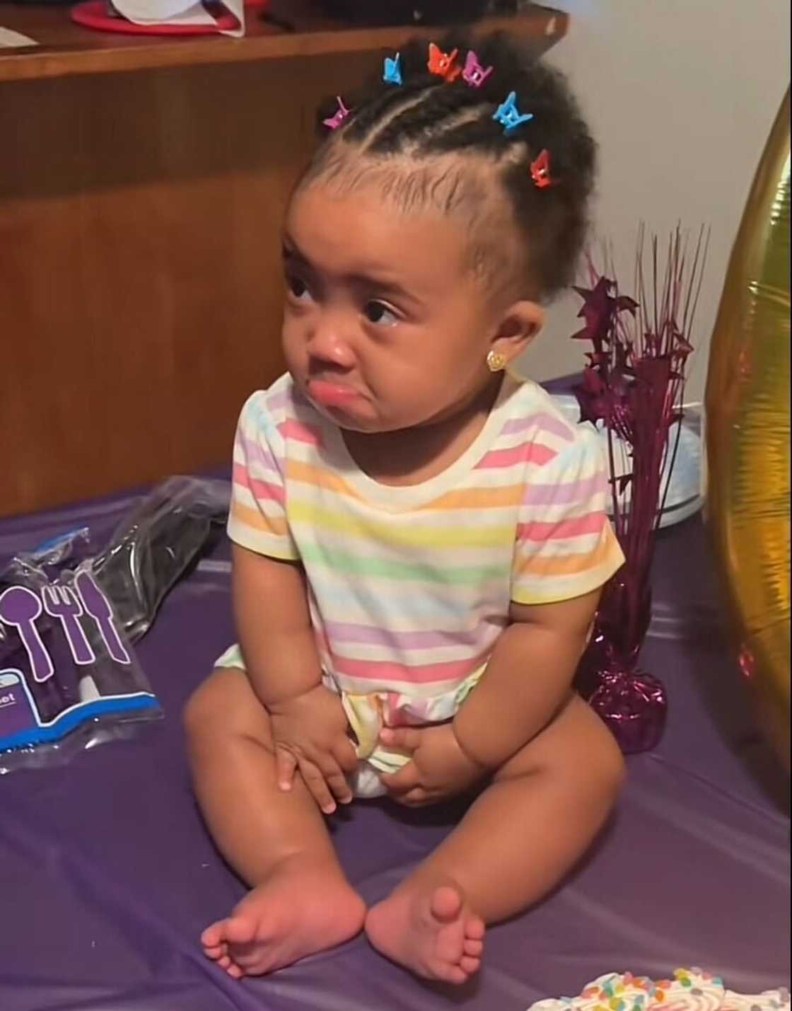 A little six-month-old baby's emotional response to a birthday song melted hearts online.