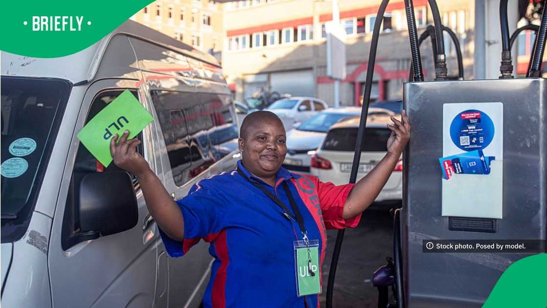 A petrol attendant showed a sign indicating that no petrol is available on March 31, 2026