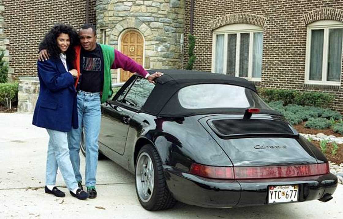 Sugar Ray Leonard and his wife Juanita Wilkinson pose outside their house in Palmer Park, Maryland.
