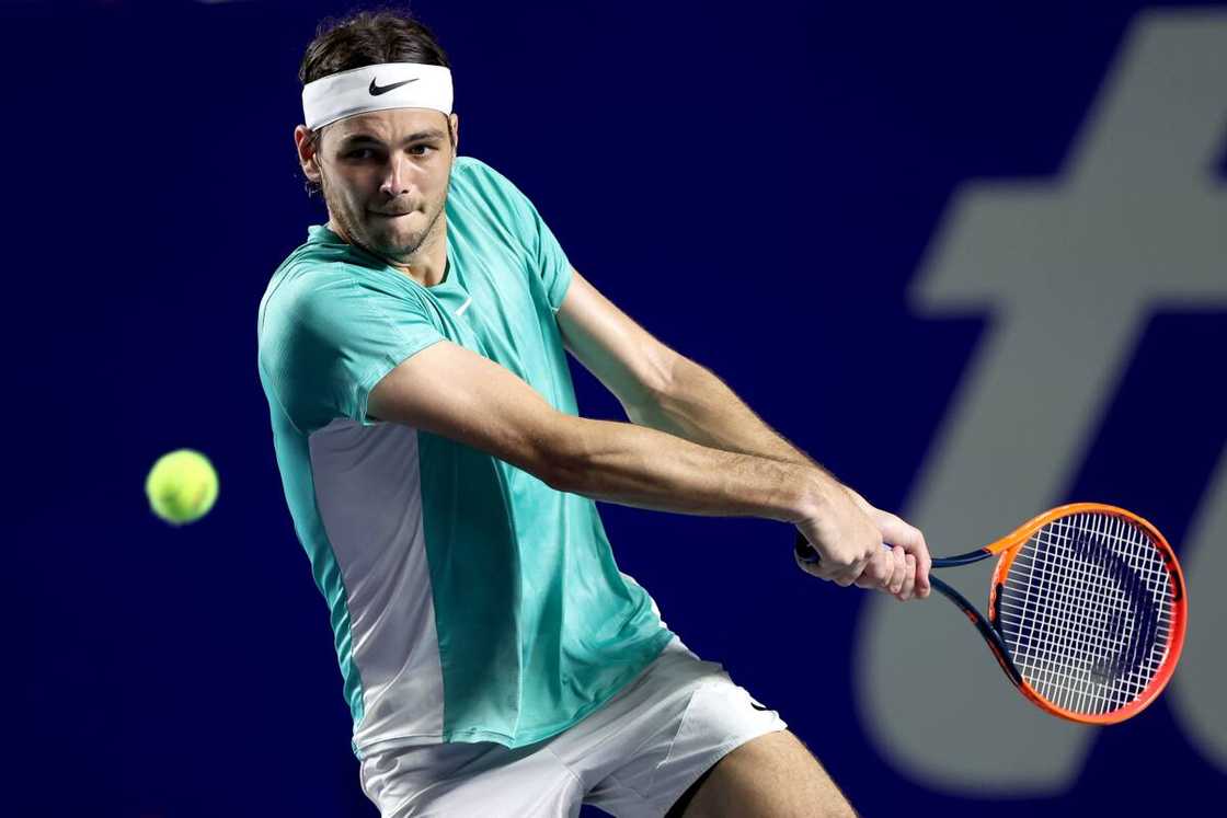 Taylor Fritz of United States returns a shot to Matteo Arnaldi of Italy during Day 1 of the Telcel ATP Mexican Open at Arena GNP Seguros in Acapulco, Mexico