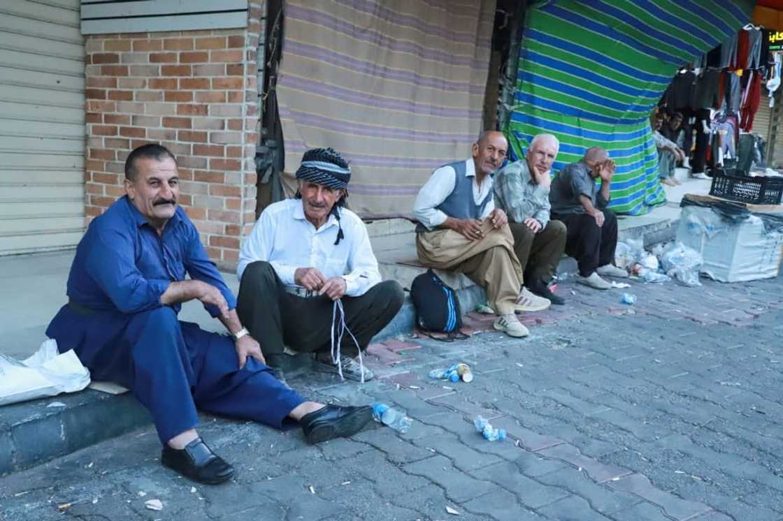 Iranian workers wait for jobs at Workers Square in front of the Great Mosque in Sulaimaniyah, in Iraq's autonomous Kurdistan region