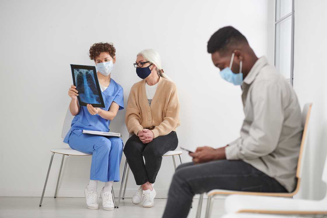 A man waiting in line in an hospital