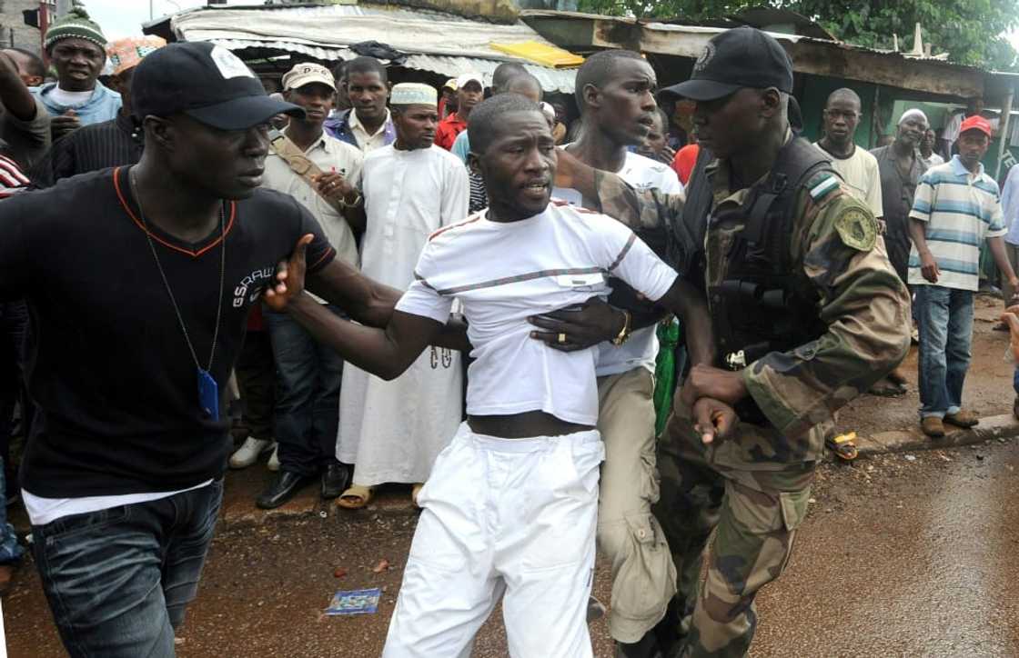 Protest: More than 150 people were killed and at least 100 women raped in the 2009 stadium massacre Protest: More than 150 people were killed and at least 100 women raped in the 2009 stadium massacre