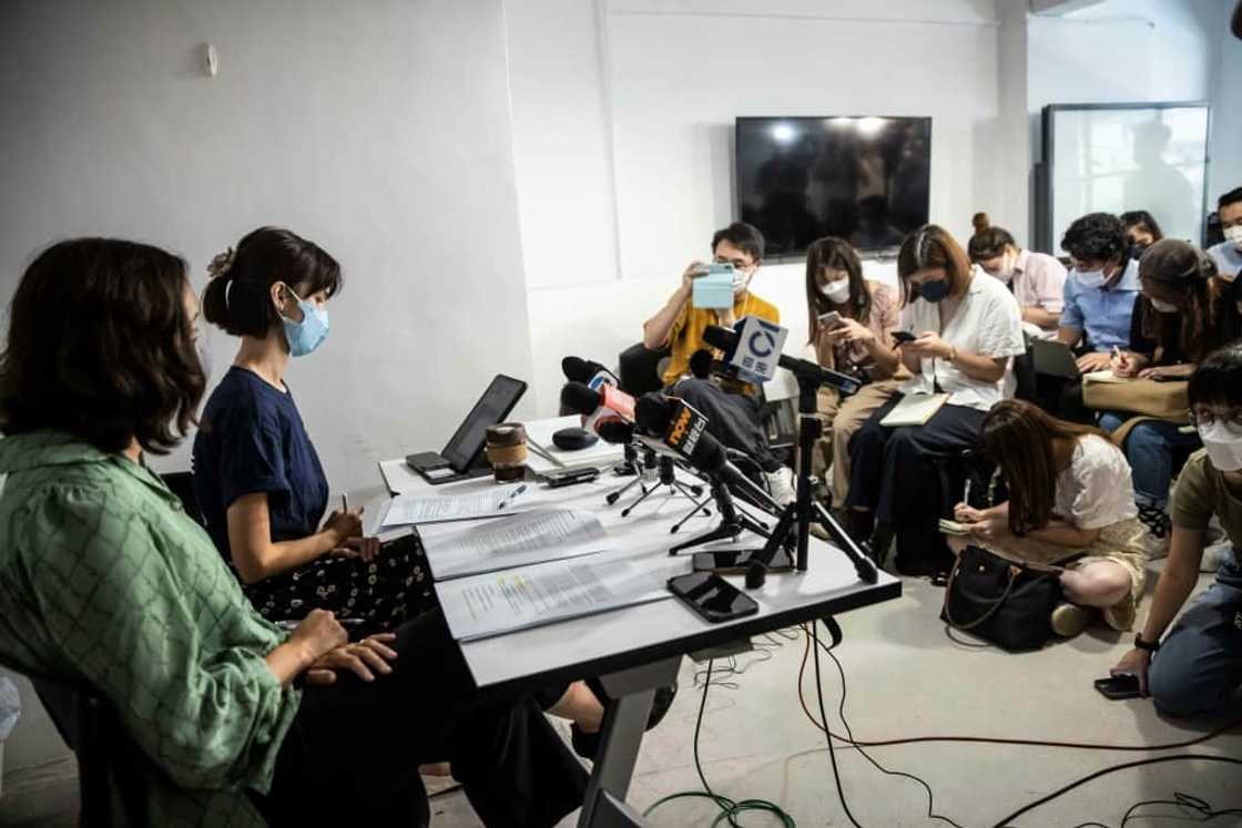 Rights lawyer Patricia Ho (L) and NGO programme manager Michelle Wong (2nd L) speak to the media in Hong Kong Rights lawyer Patricia Ho (L) and NGO programme manager Michelle Wong (2nd L) speak to the media in Hong Kong