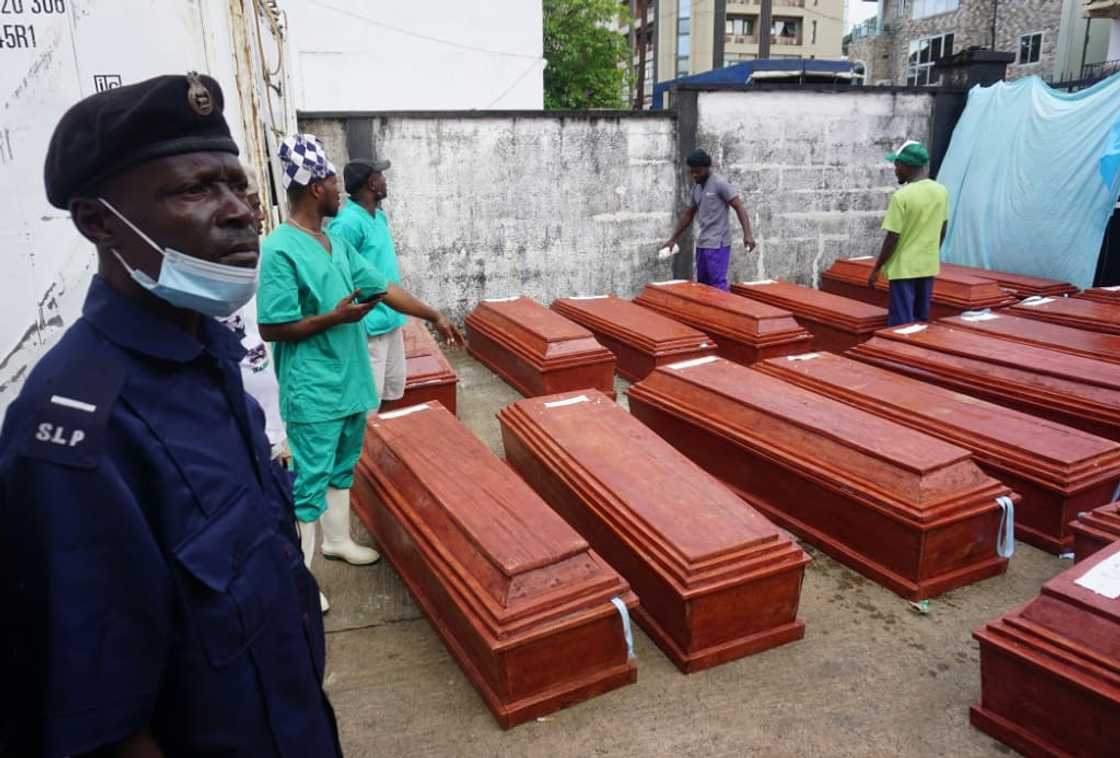 Families had initially feared the dead would be buried in mass graves Families had initially feared the dead would be buried in mass graves