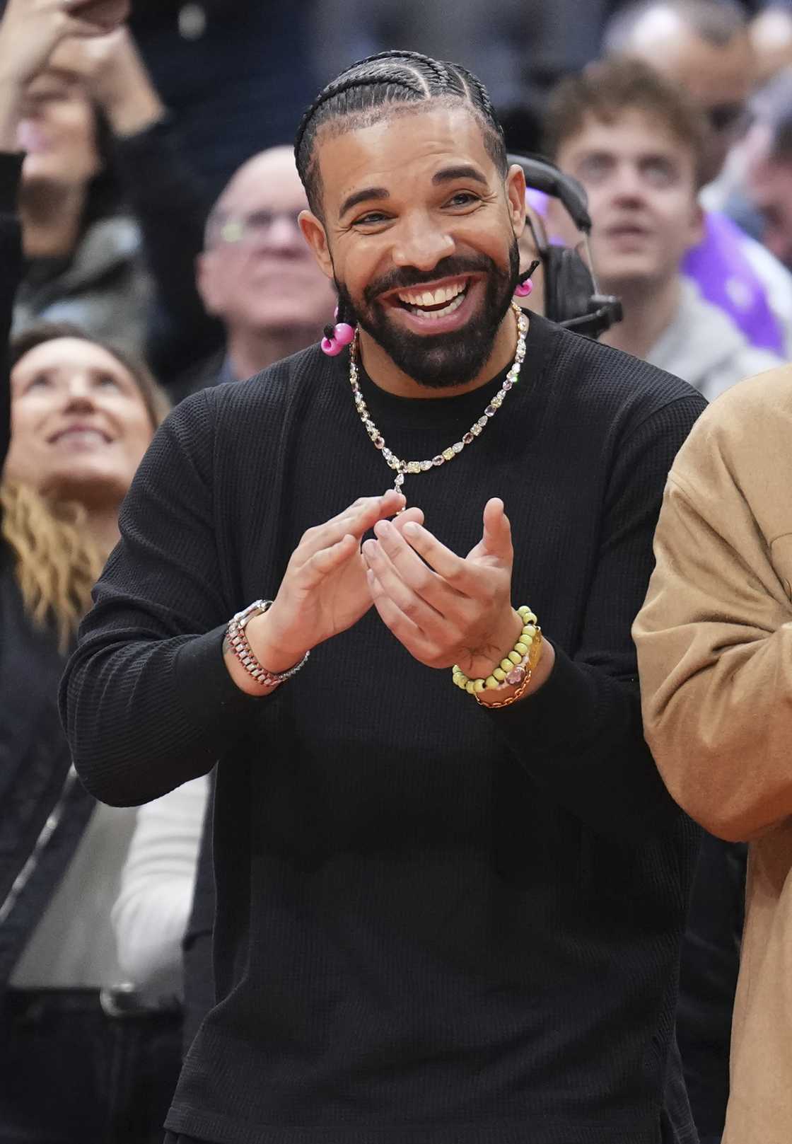 Drake's fans hit him with bottles while performing.