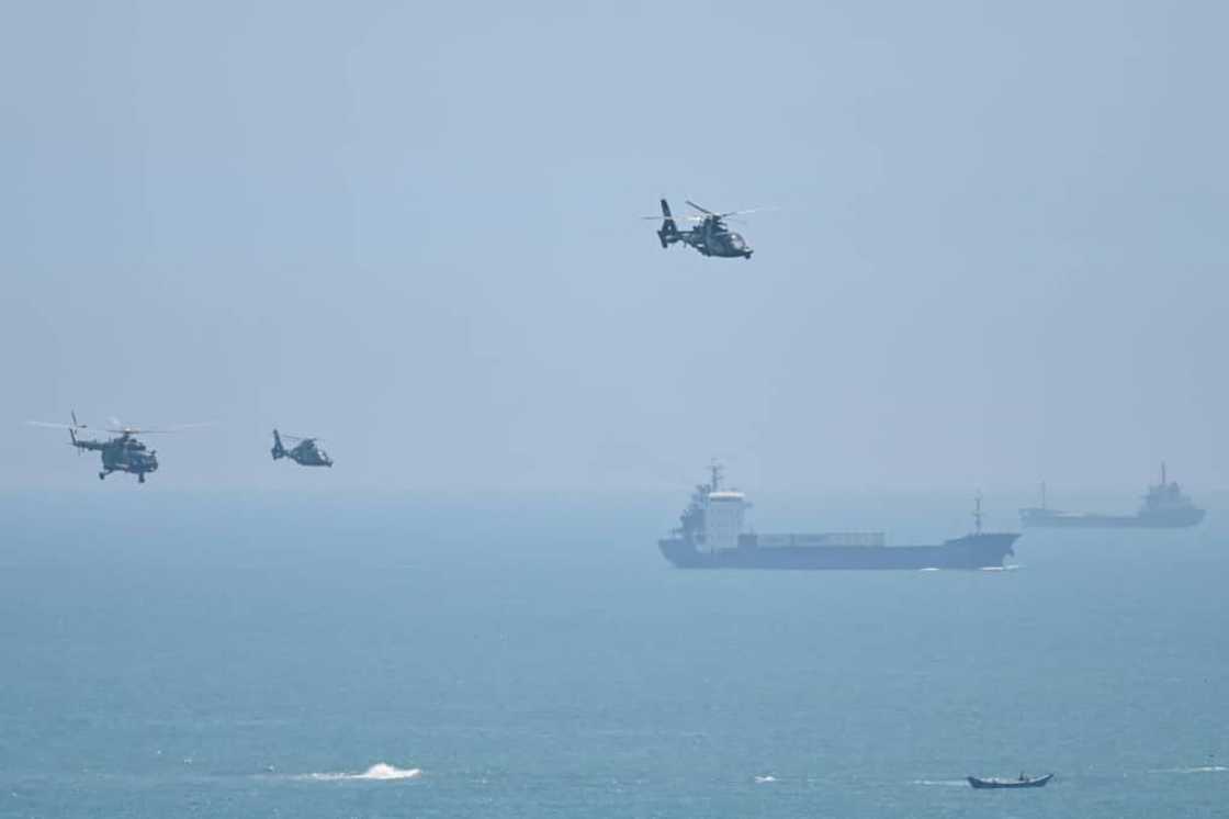 Chinese military helicopters fly past Pingtan island, one of mainland China's closest points to Taiwan, on August 4, 2022