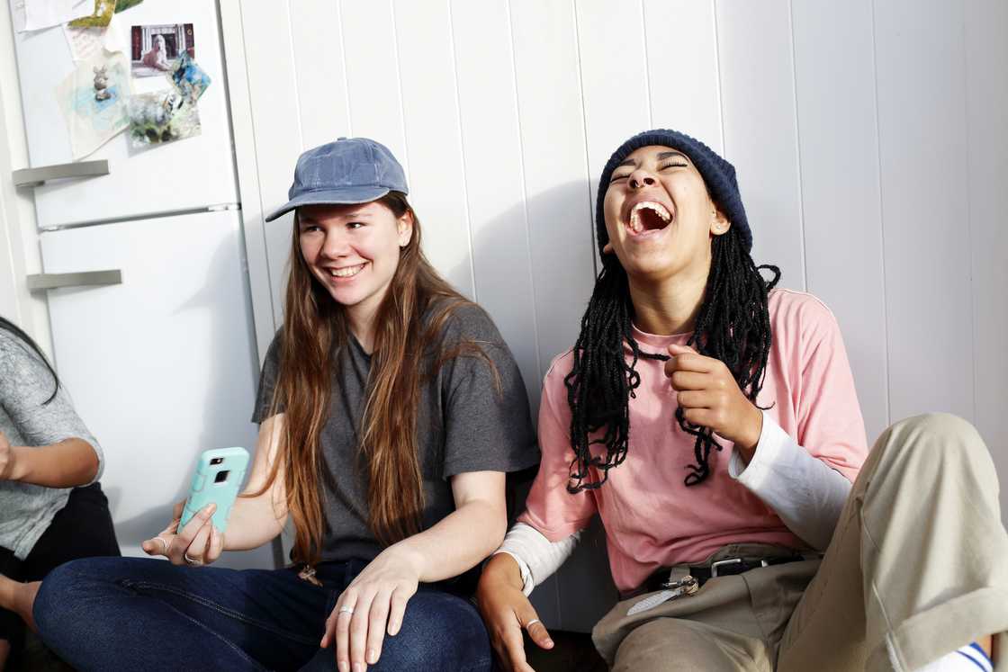 Girls hanging out and laughing together. Girls hanging out and laughing together.
