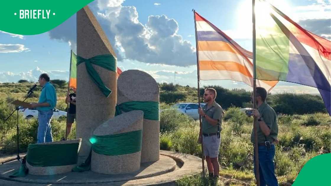Orania residents captured holding flags Orania residents captured holding flags