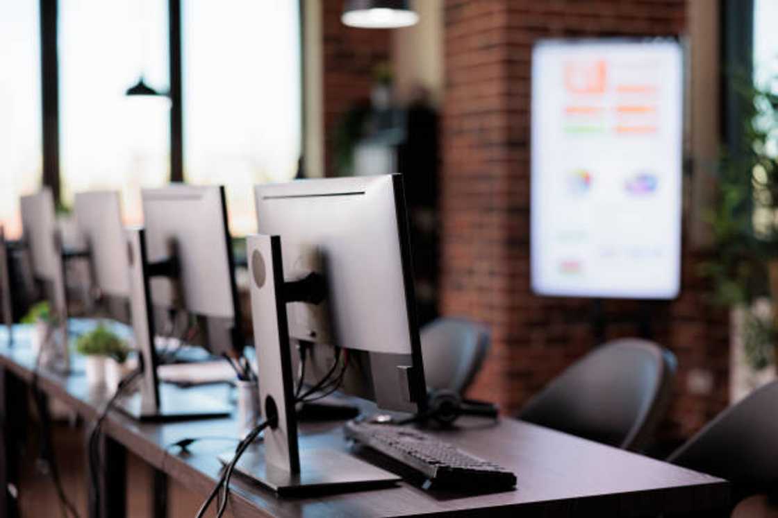 A bank of computers in an office