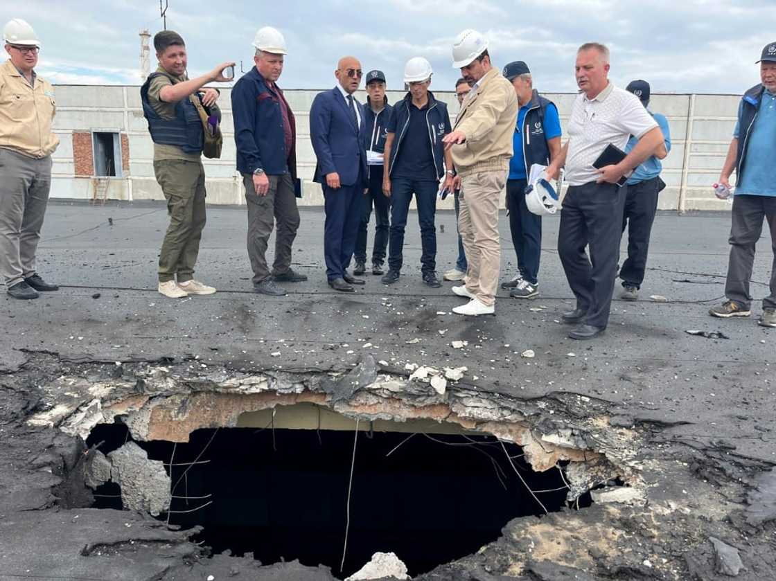 Members of the IAEA team inspected the damage caused by shelling during a recent visit to the plant Members of the IAEA team inspected the damage caused by shelling during a recent visit to the plant